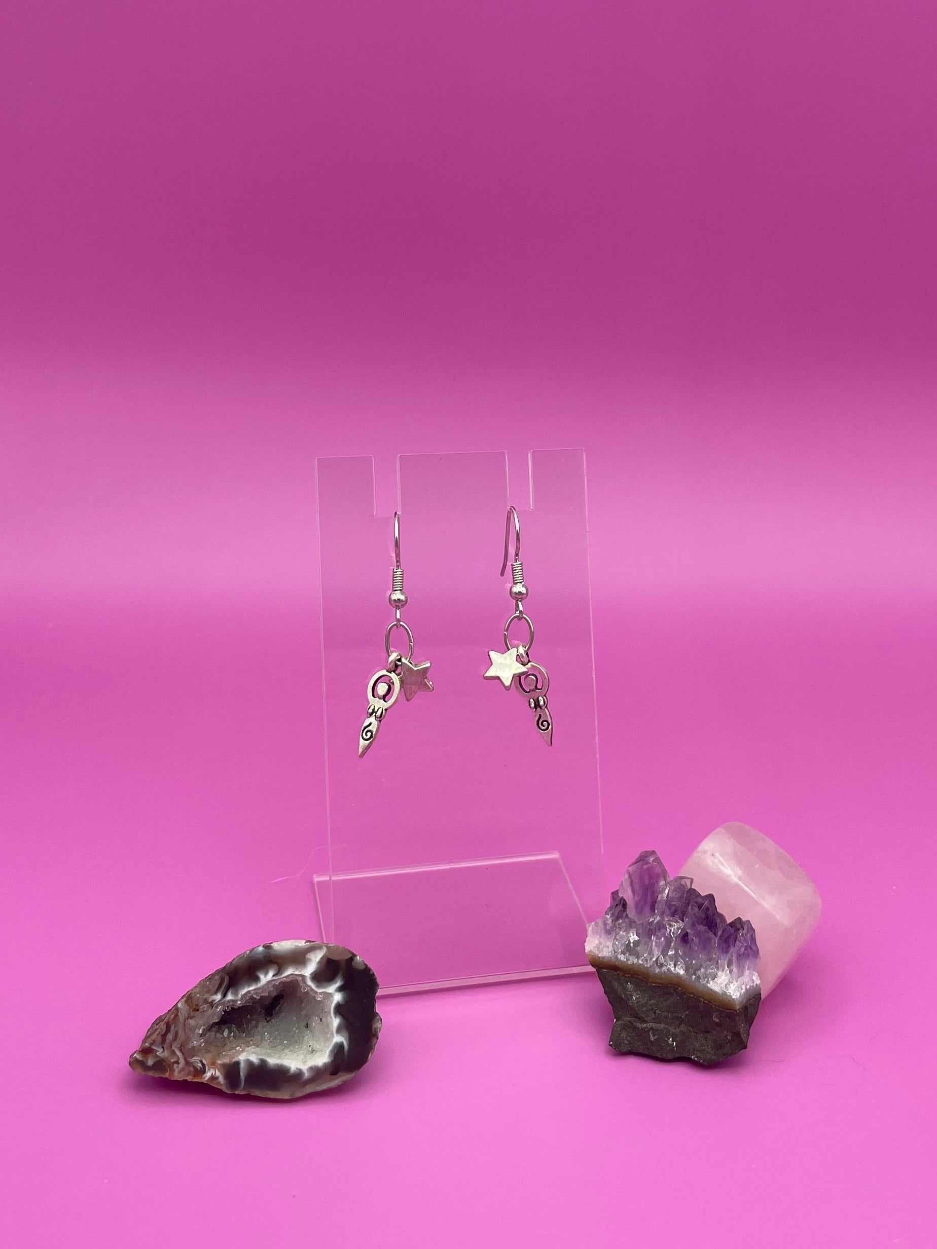 Mother of life with star earrings on clear stand 