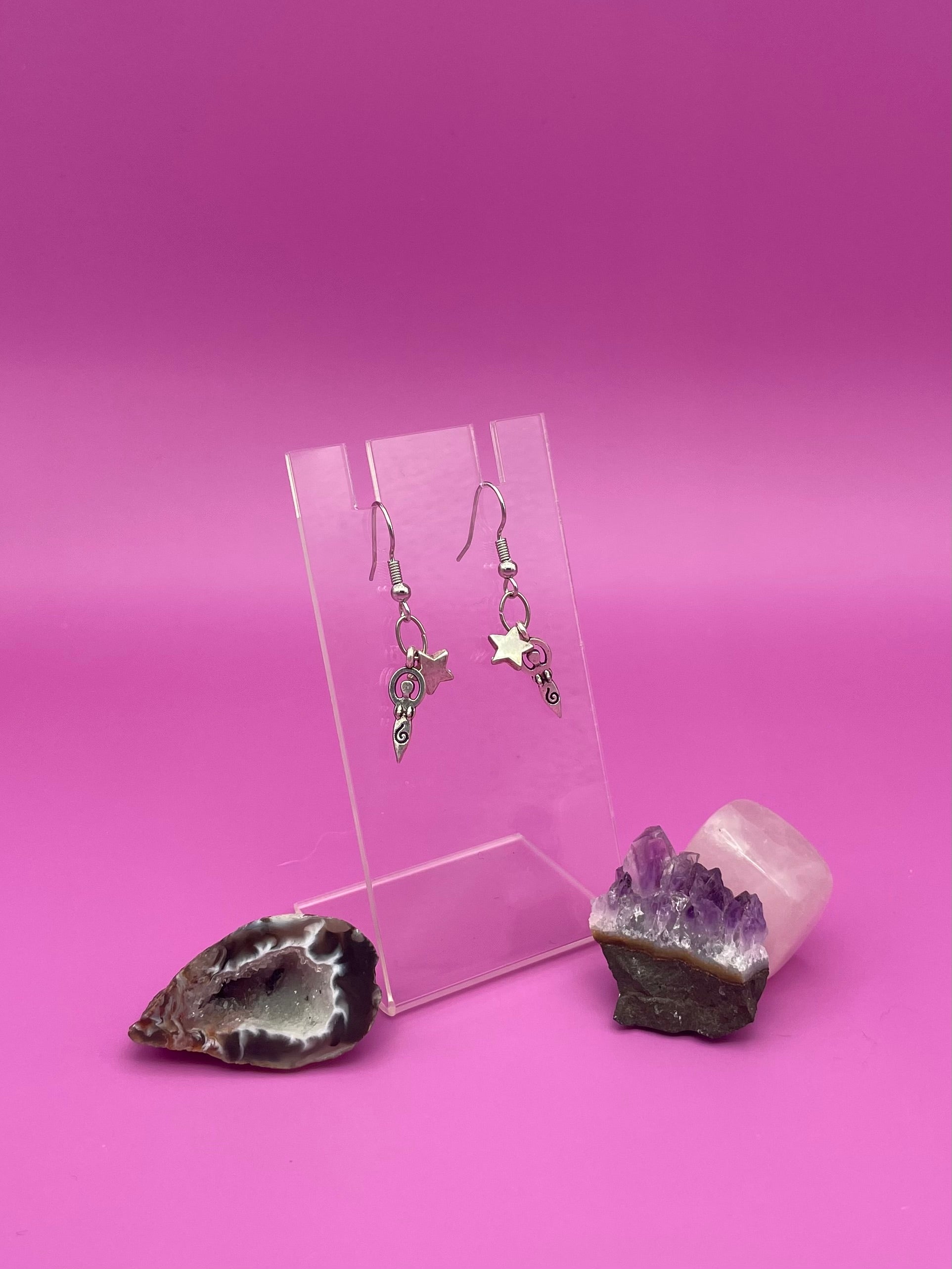 Mother of life with star earrings on clear stand 